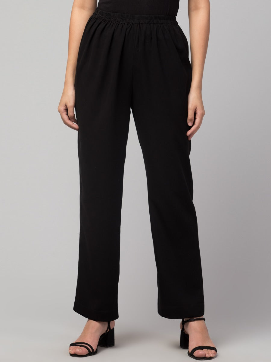 Black solid, high-rise trouser.