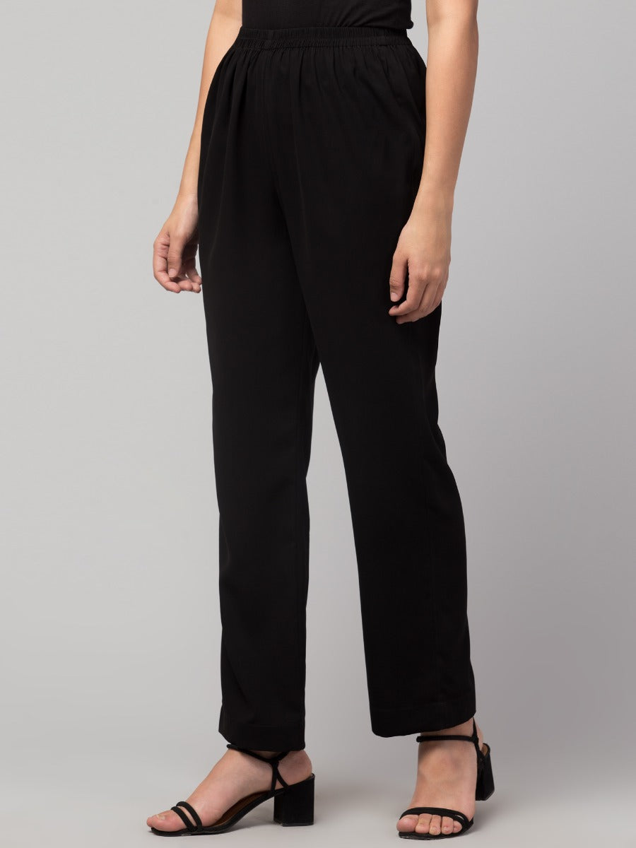 Black solid, high-rise trouser.