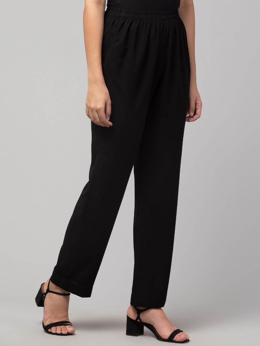 Black solid, high-rise trouser.