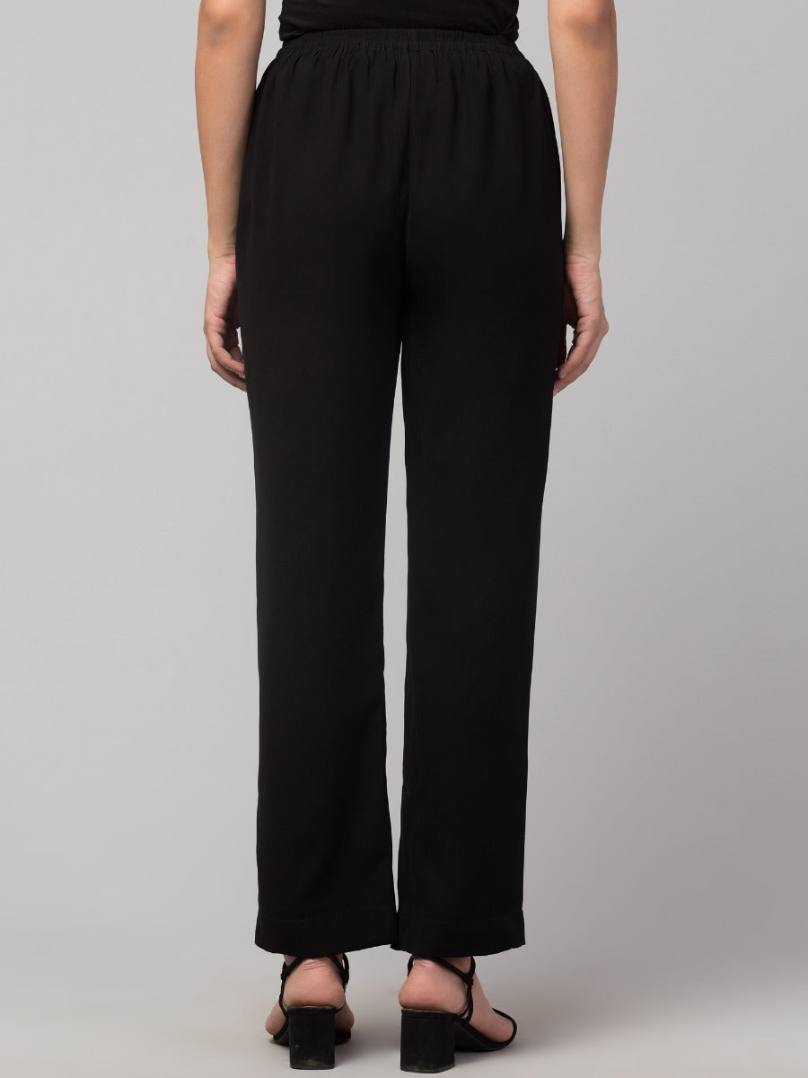 Black solid, high-rise trouser.