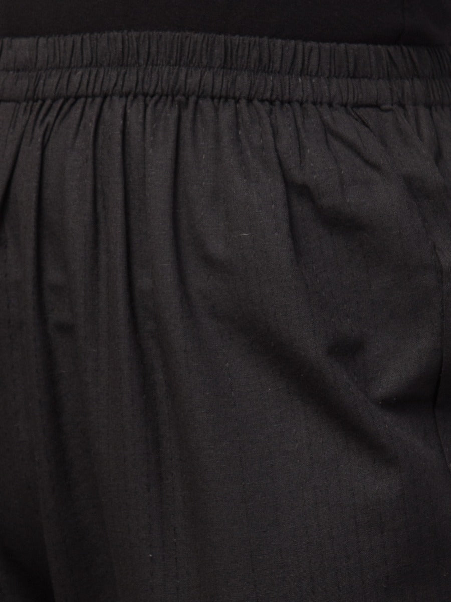 Black solid, high-rise trouser.