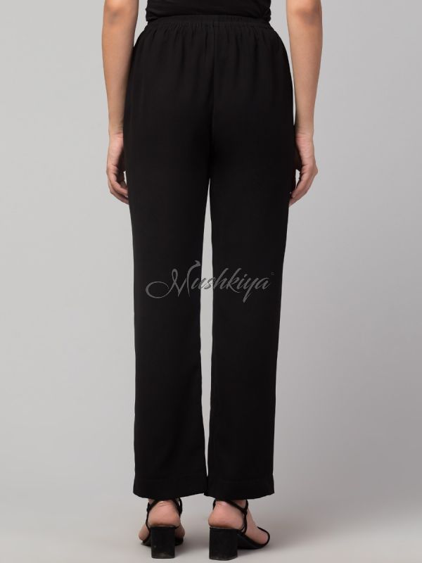 Black solid, high-rise trouser.